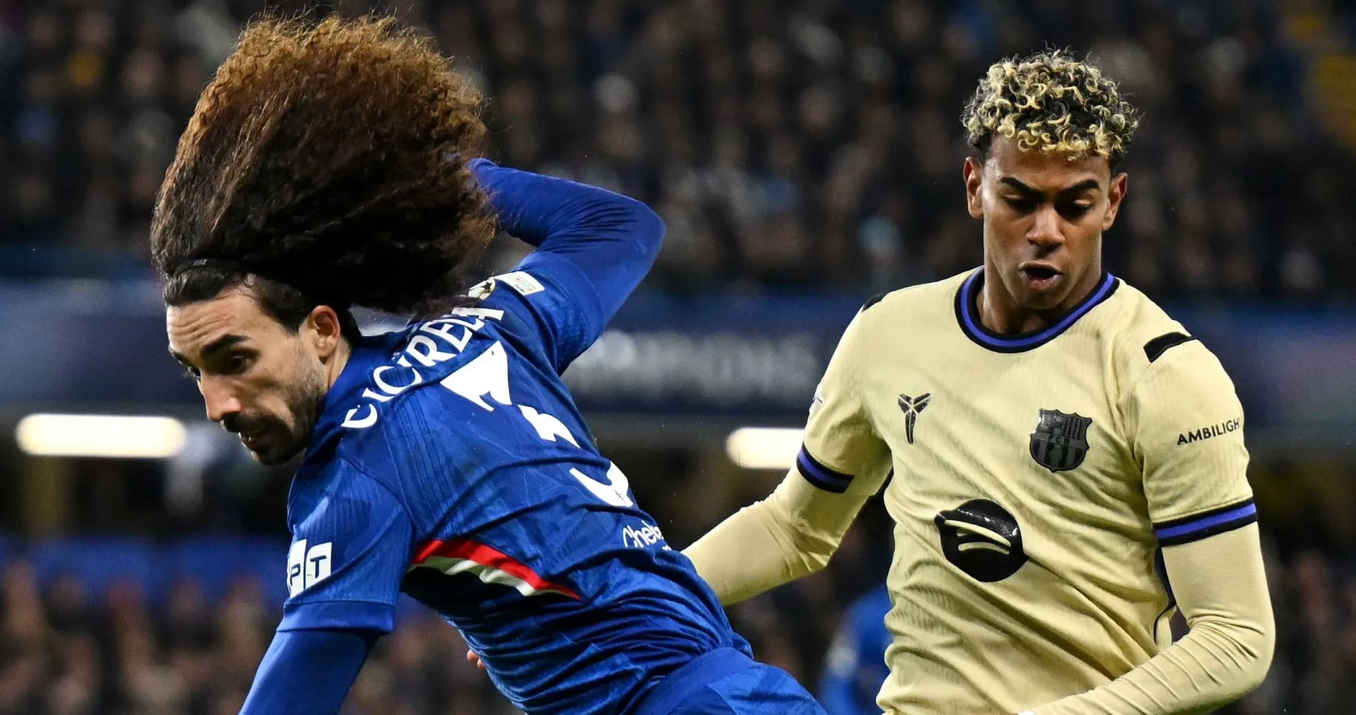 Two players competing for the ball during match