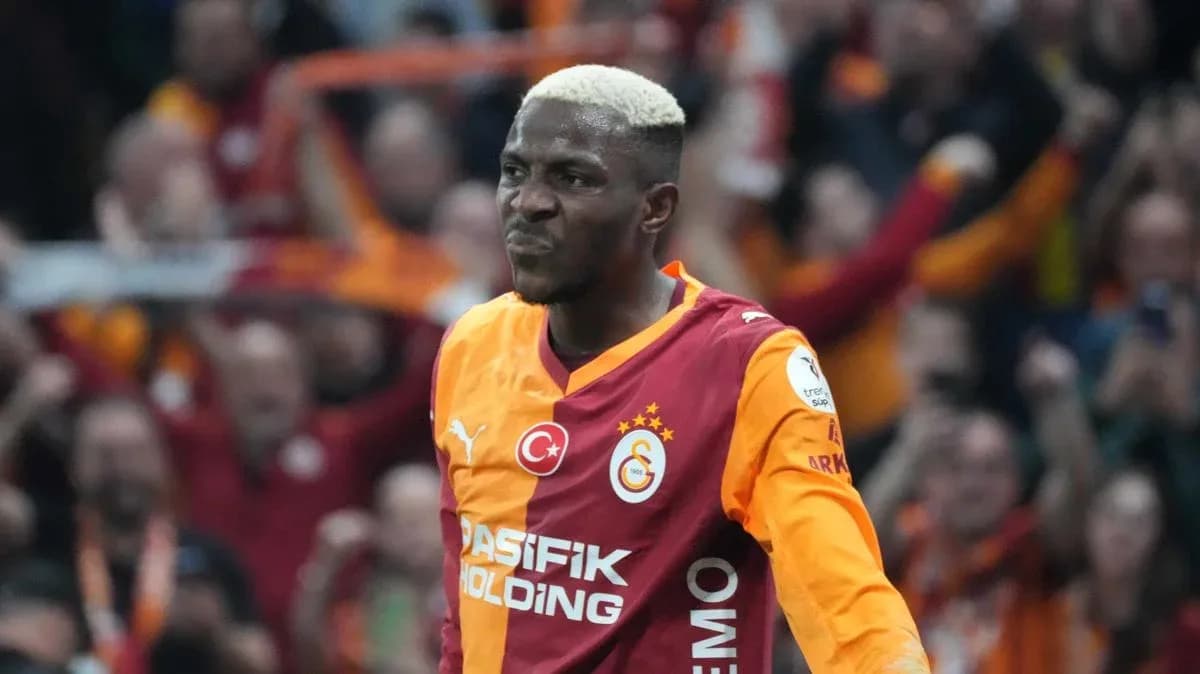 Galatasaray player celebrating in front of fans