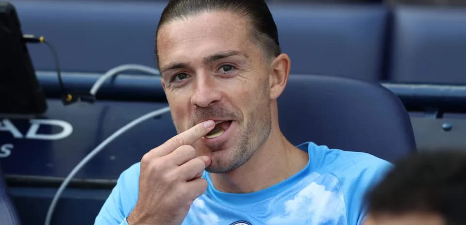 Player sitting on bench, eating snack during match