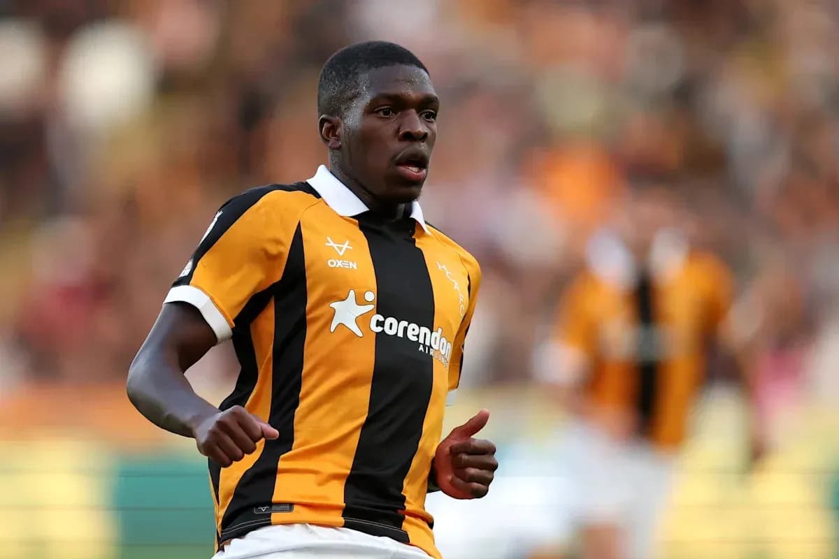 Player running on the pitch in team colors