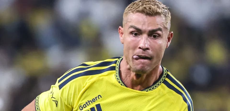 Player running with ball during match in yellow jersey