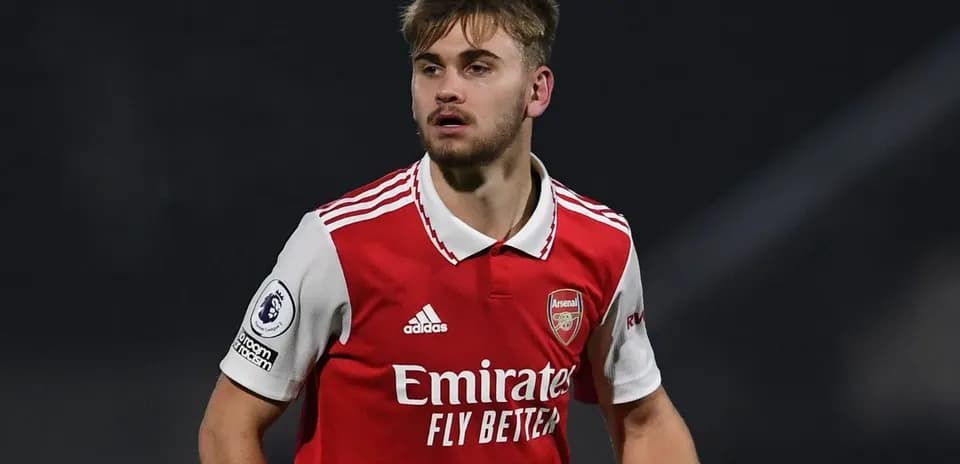 Player wearing Arsenal kit during match action