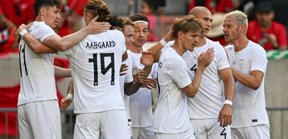 Players celebrating a goal during a match