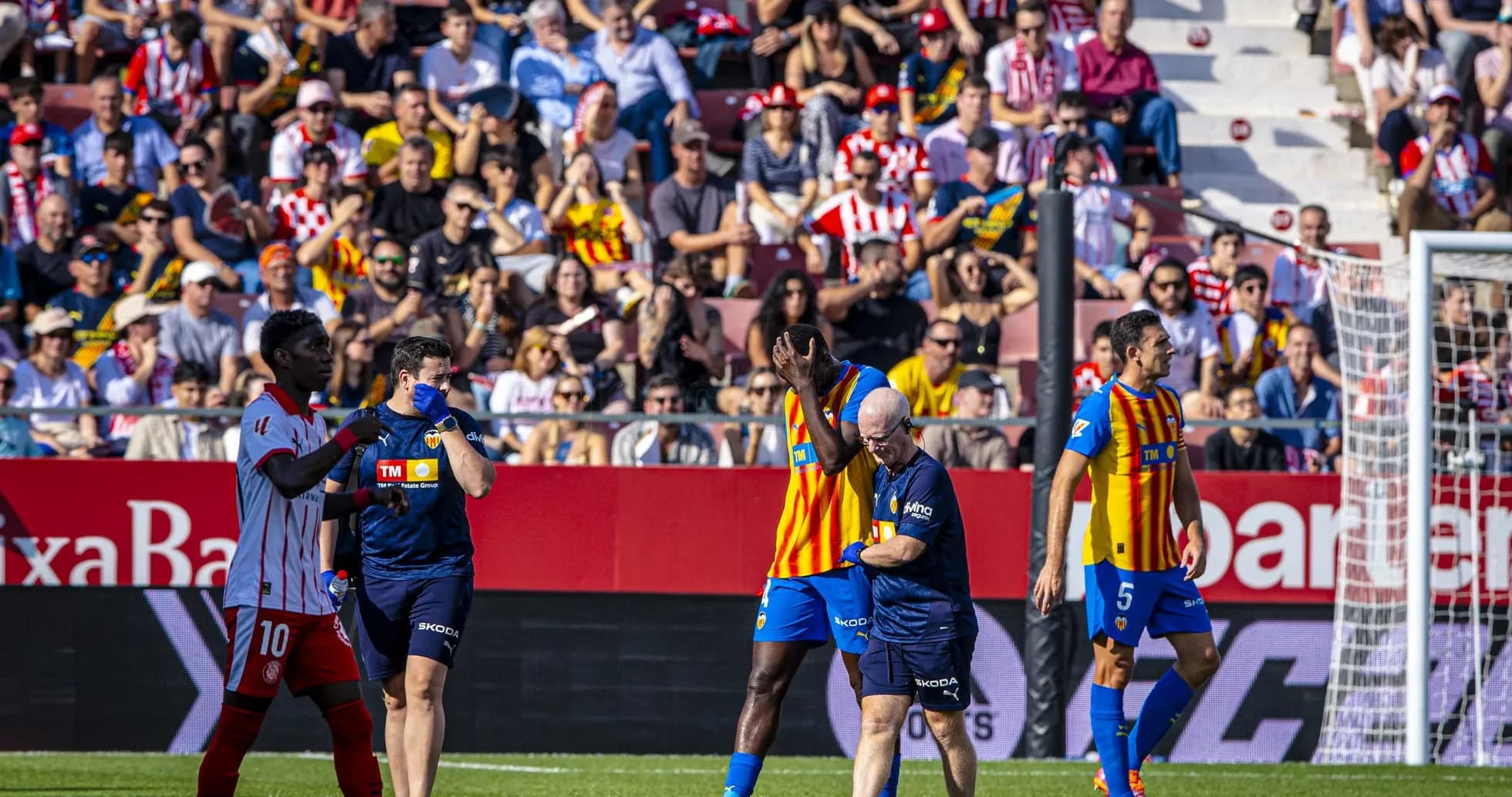 Players interacting during Valencia vs Girona match