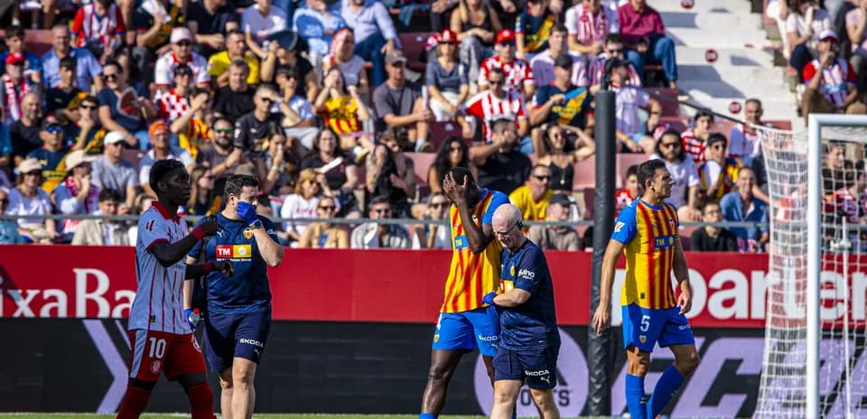 Players interacting during Valencia vs Girona match