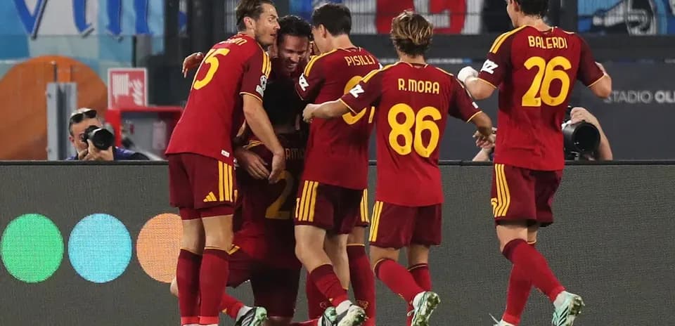 Players celebrating a goal during a match