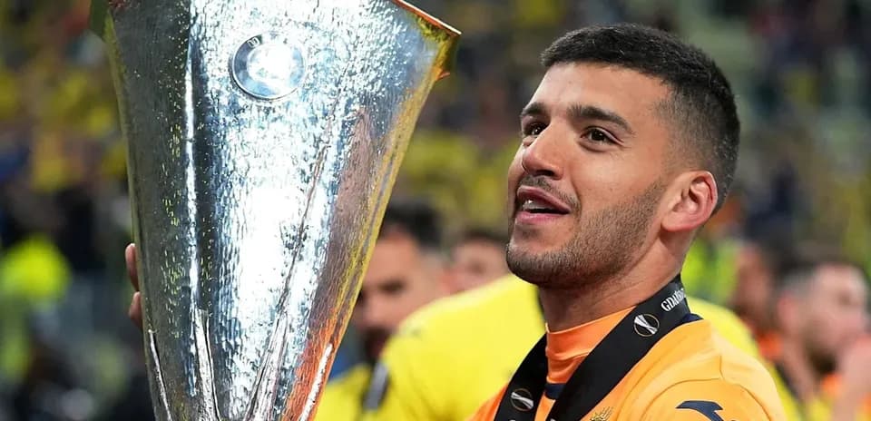 Player celebrating with UEFA Europa League trophy
