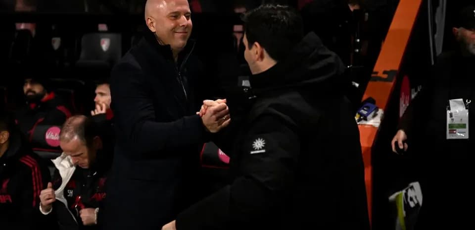 Coaches shaking hands in the technical area