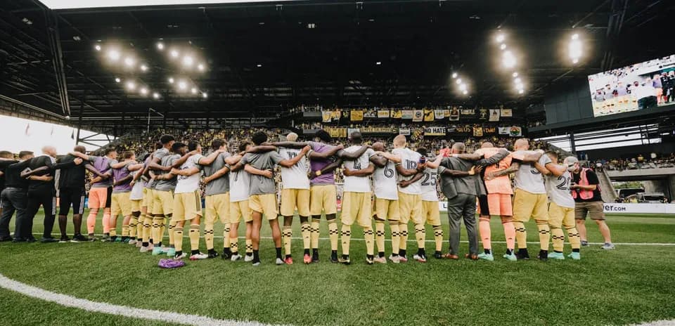 Columbus Crew players huddling before the match