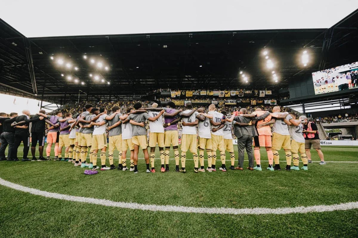 Columbus Crew players huddling before the match