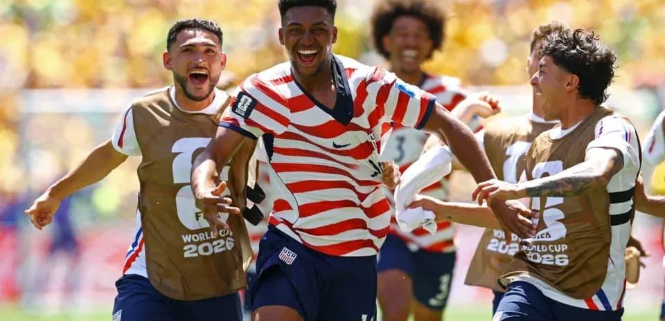 US players celebrating a goal during match