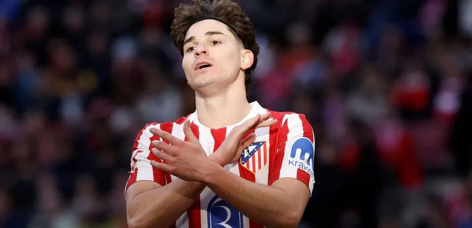Atletico Madrid player gesturing during a match