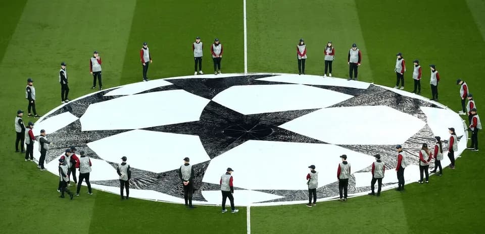 Ground staff preparing Champions League logo before match