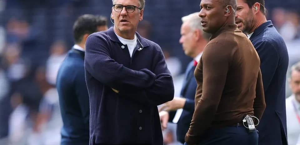 Coaches discussing strategies on the sidelines