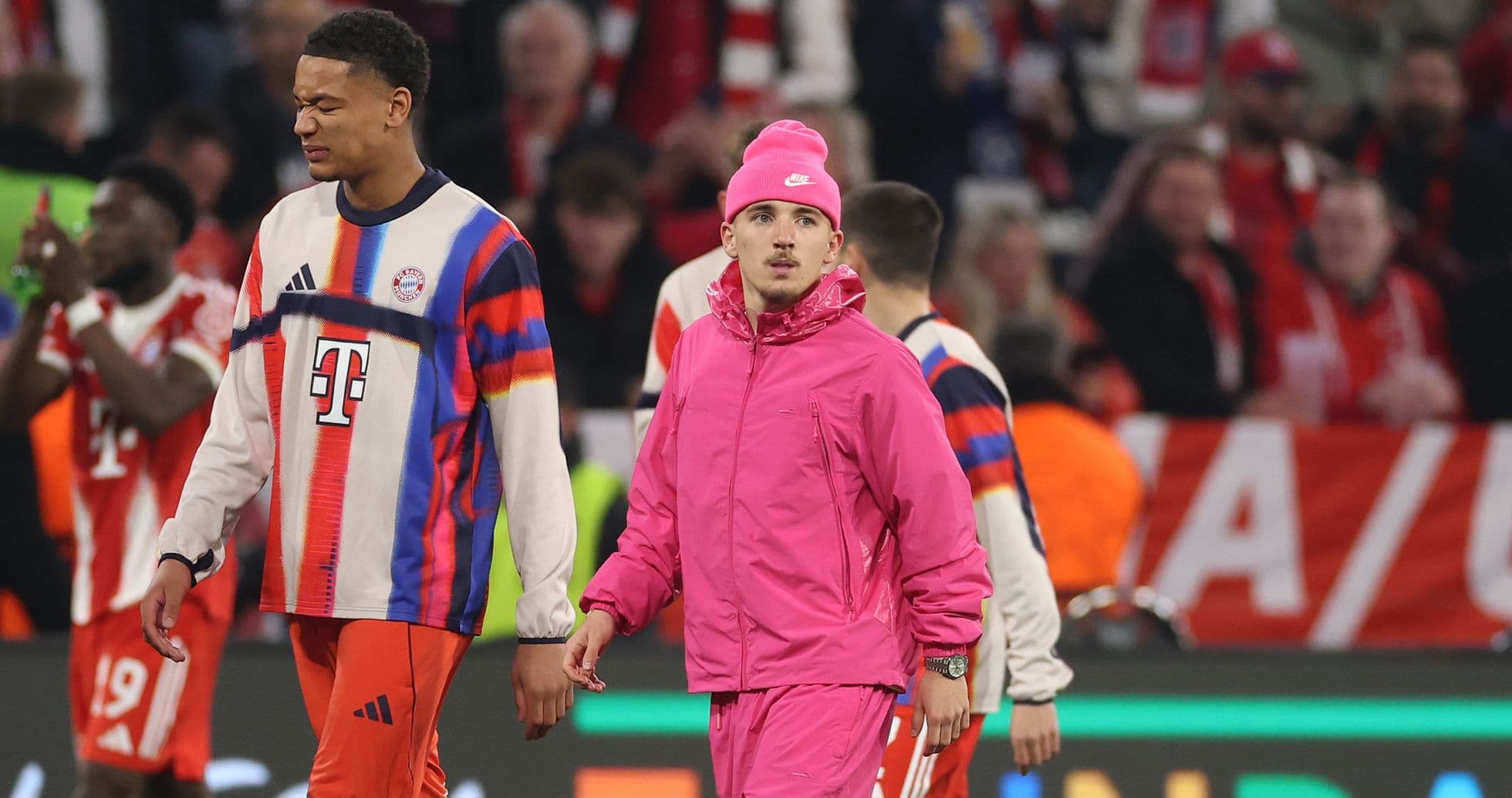 Bayern Munich players in warm-up gear on field