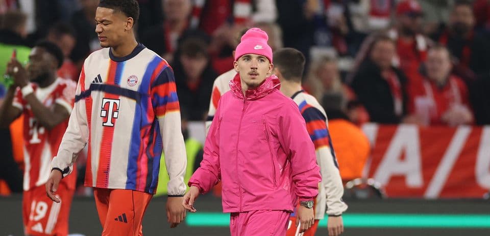 Bayern Munich players in warm-up gear on field