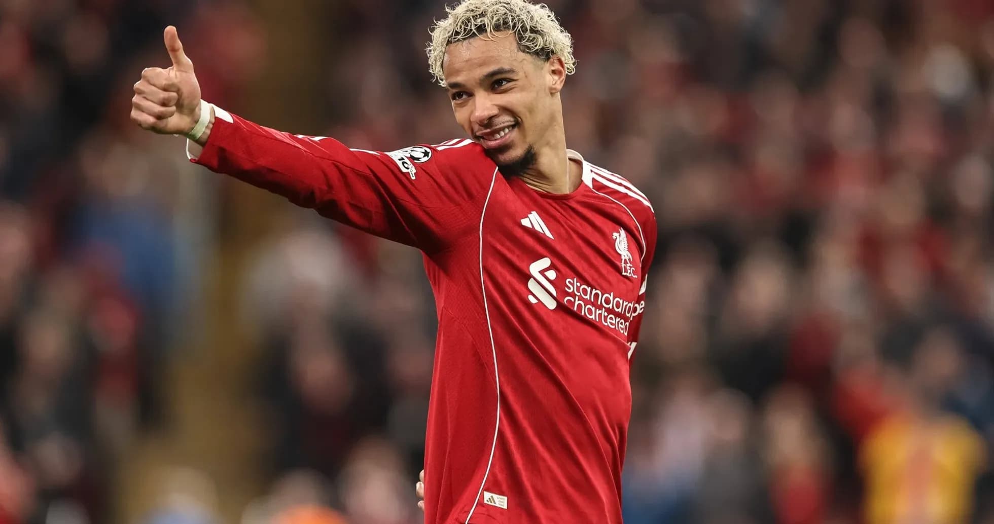 Player giving thumbs up in Liverpool jersey