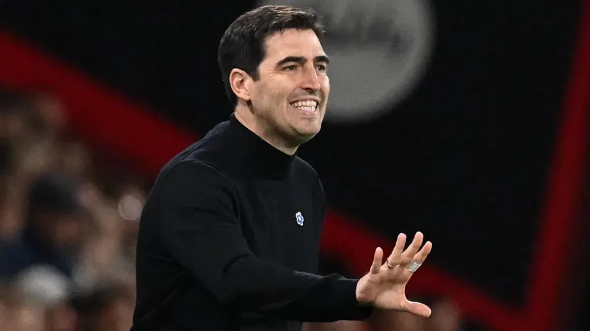 Coach gesturing during a match on the sidelines