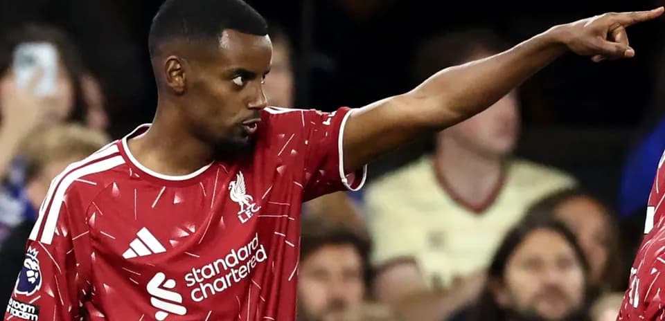 Player in Liverpool jersey gesturing during match