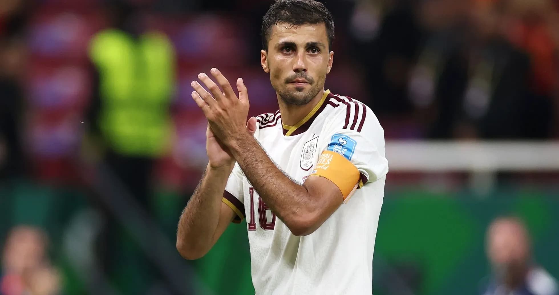 Player applauding fans wearing national team jersey