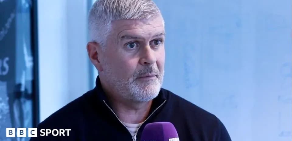 Man speaking during an interview in studio