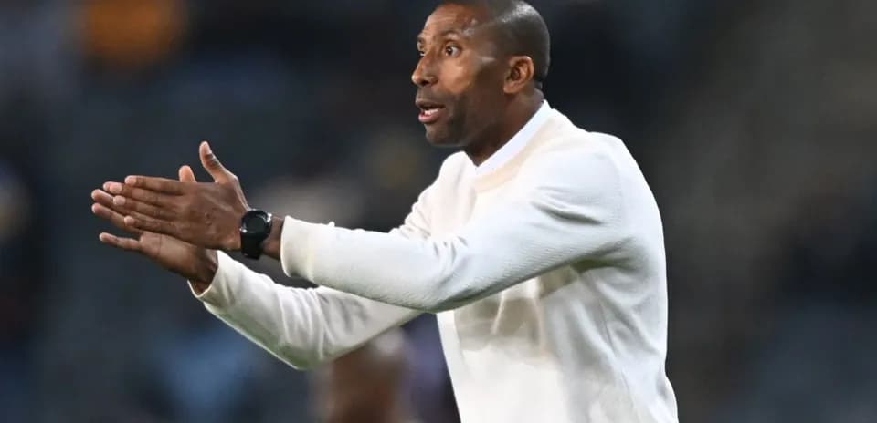 Coach gesturing during a match from the sidelines