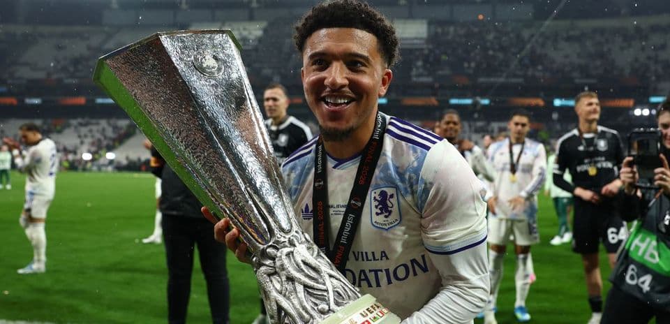 Player celebrating with UEFA Europa League trophy
