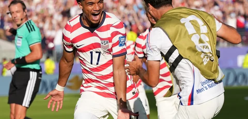 USA players celebrating a goal during World Cup match