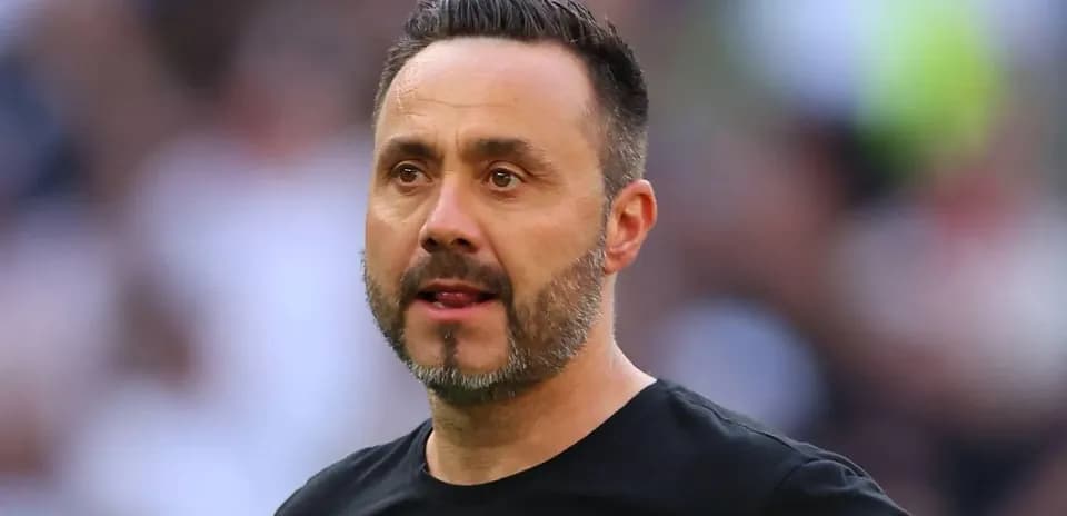 Coach observing during a football match
