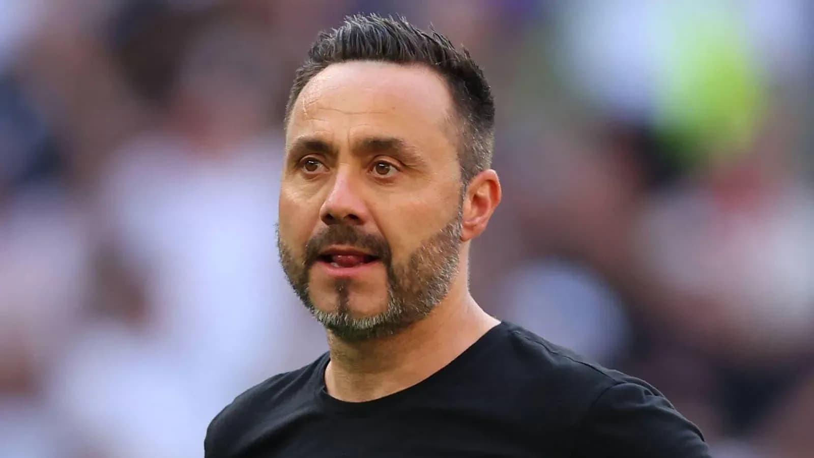 Coach observing during a football match