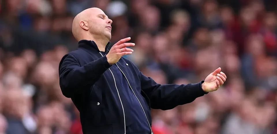 Coach gesturing during a football match on sidelines