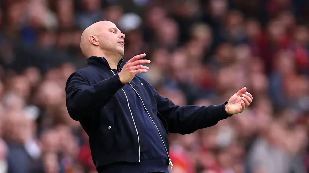 Coach gesturing during a football match on sidelines