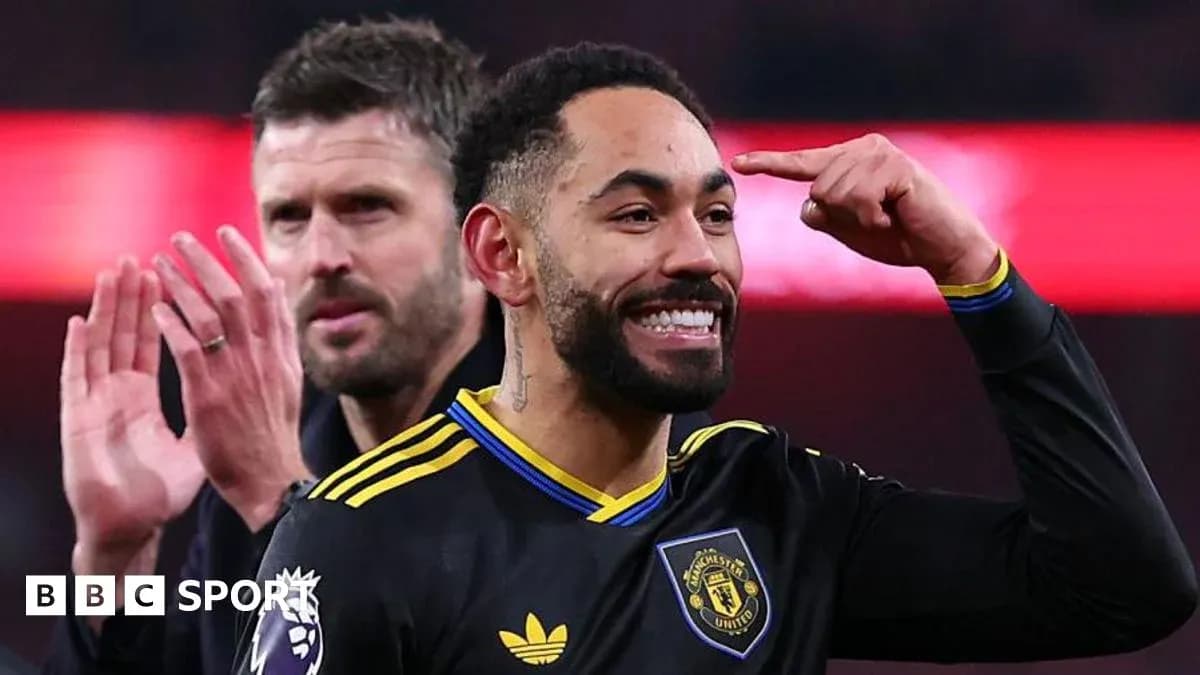 Player celebrating with teammate after scoring goal