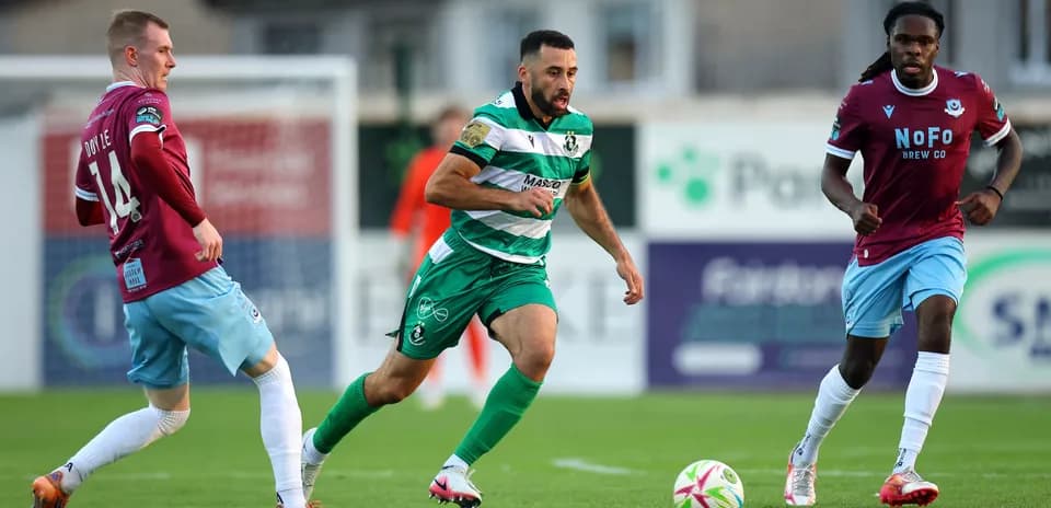 Shamrock Rovers player dribbling during match