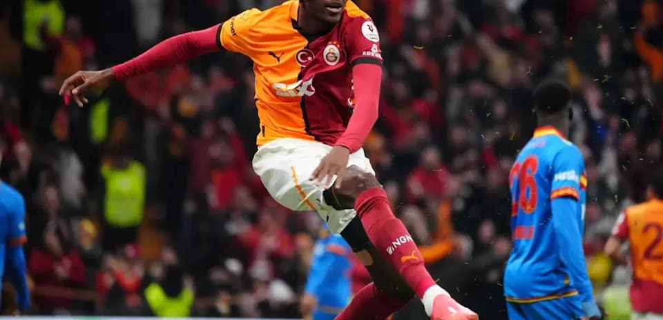 Player celebrating a goal in Galatasaray uniform