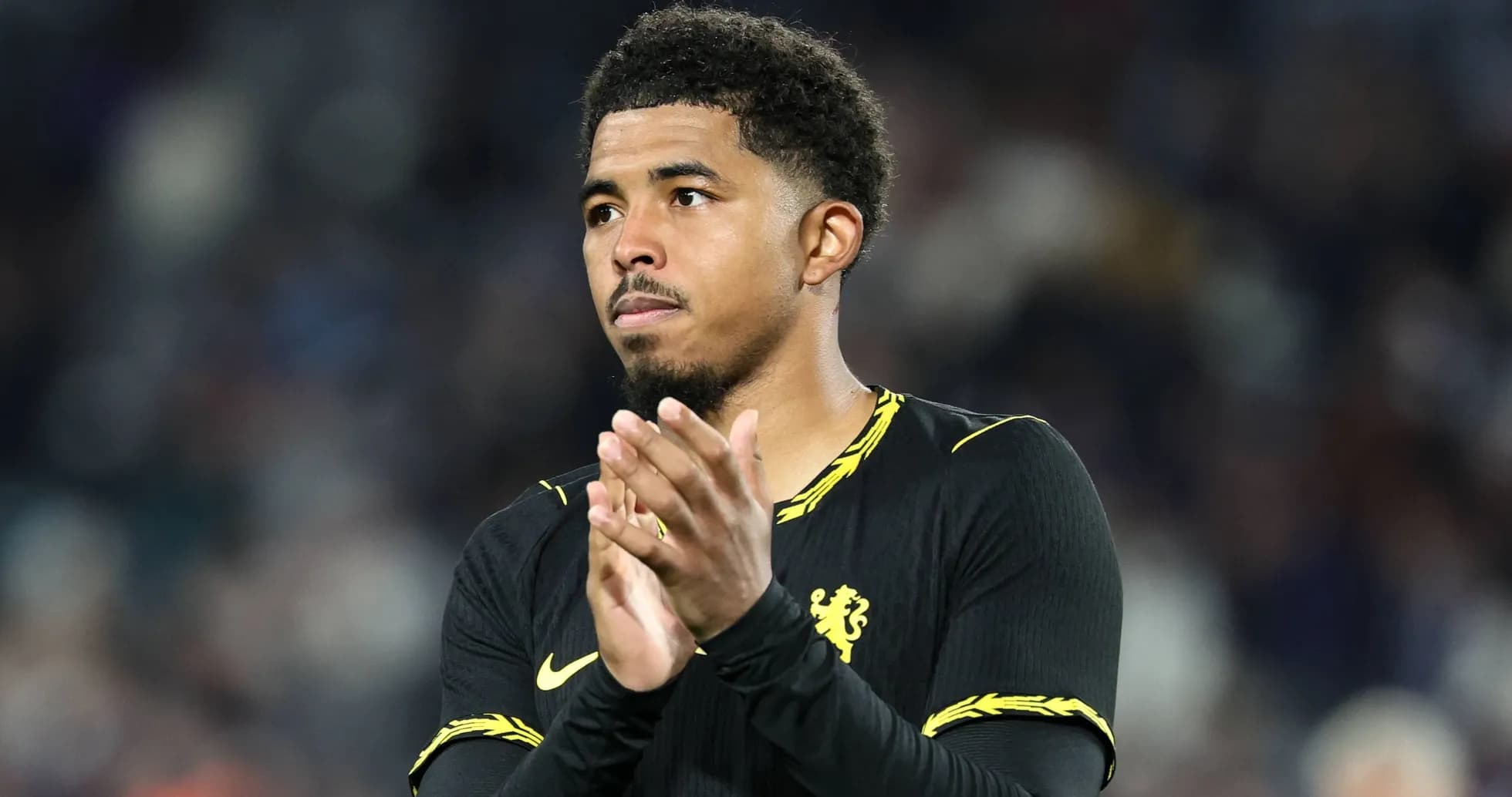 Player applauding fans after the match