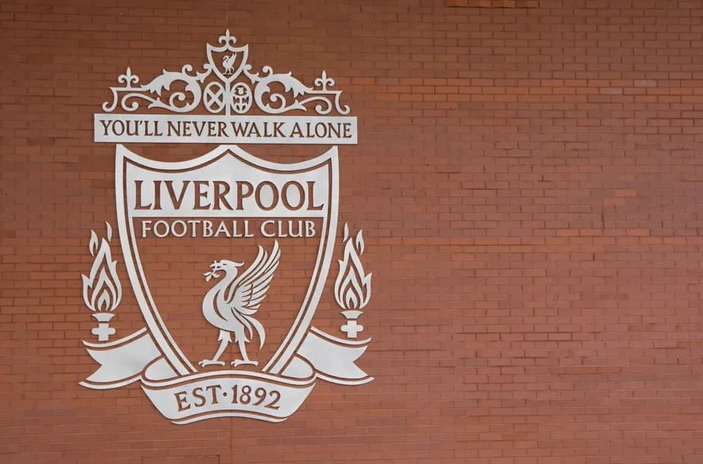 Liverpool Football Club crest on brick wall