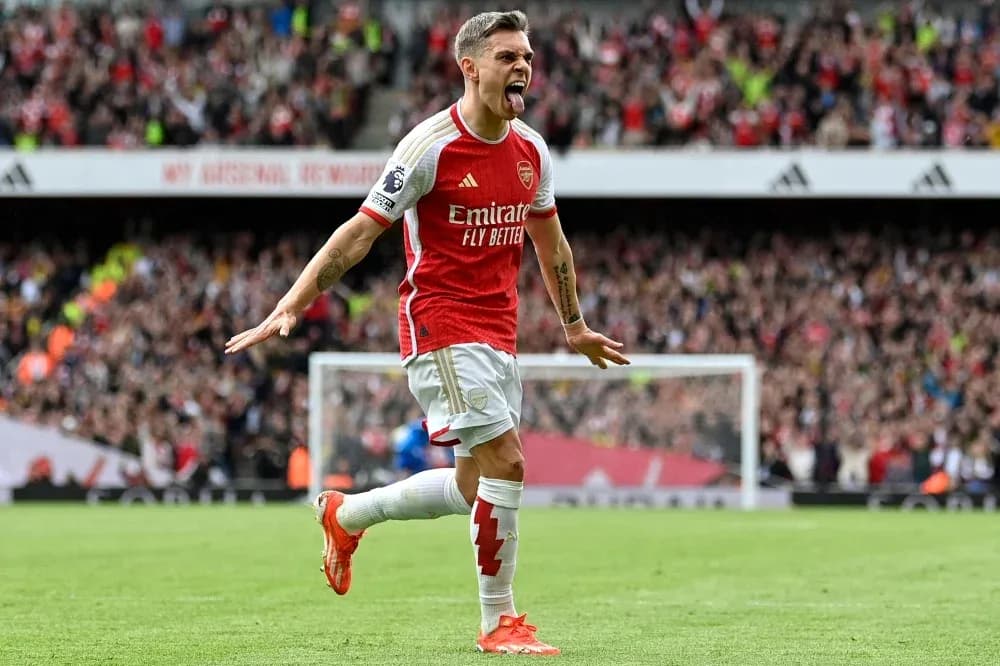 Arsenal player celebrating a goal with fans