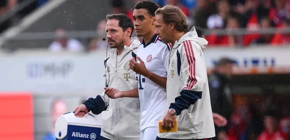 Player receiving medical attention on the sidelines