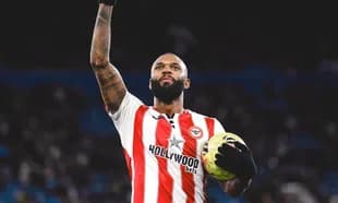 Brentford player celebrating with football