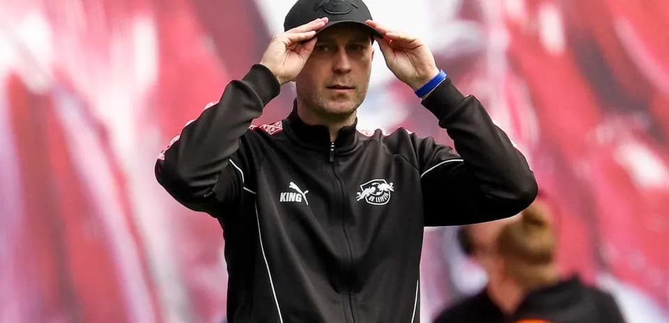 Coach adjusting cap during a match