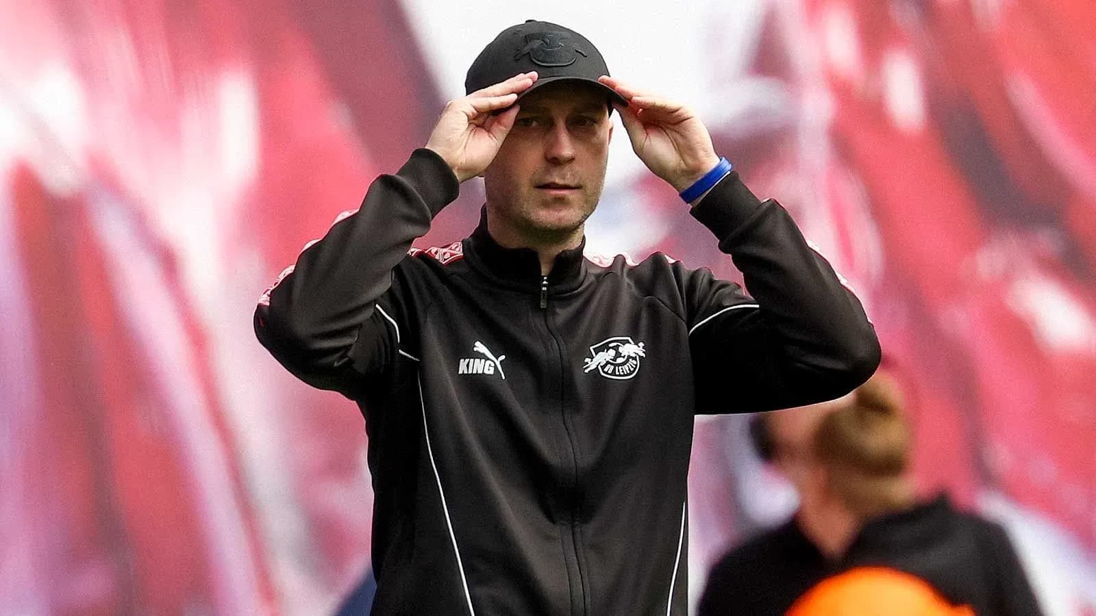 Coach adjusting cap during a match