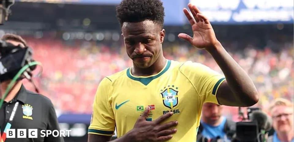 Player waving while leaving the field after match