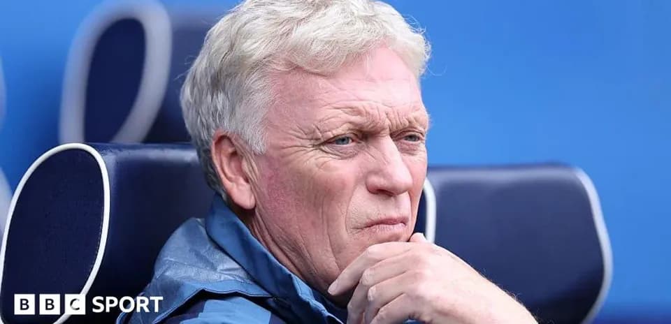Coach sitting on bench during a match
