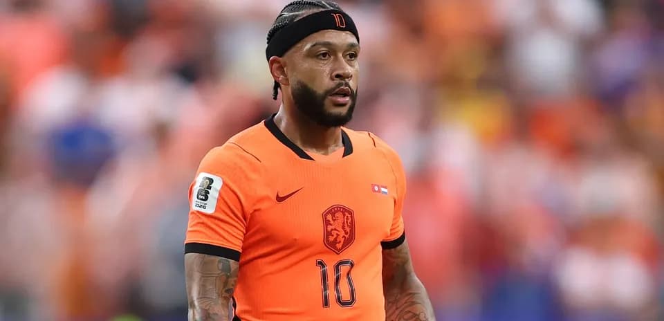 Player in orange jersey during a football match