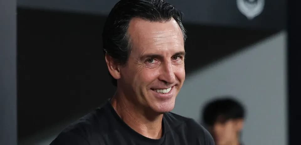 Coach smiling during match at the sidelines