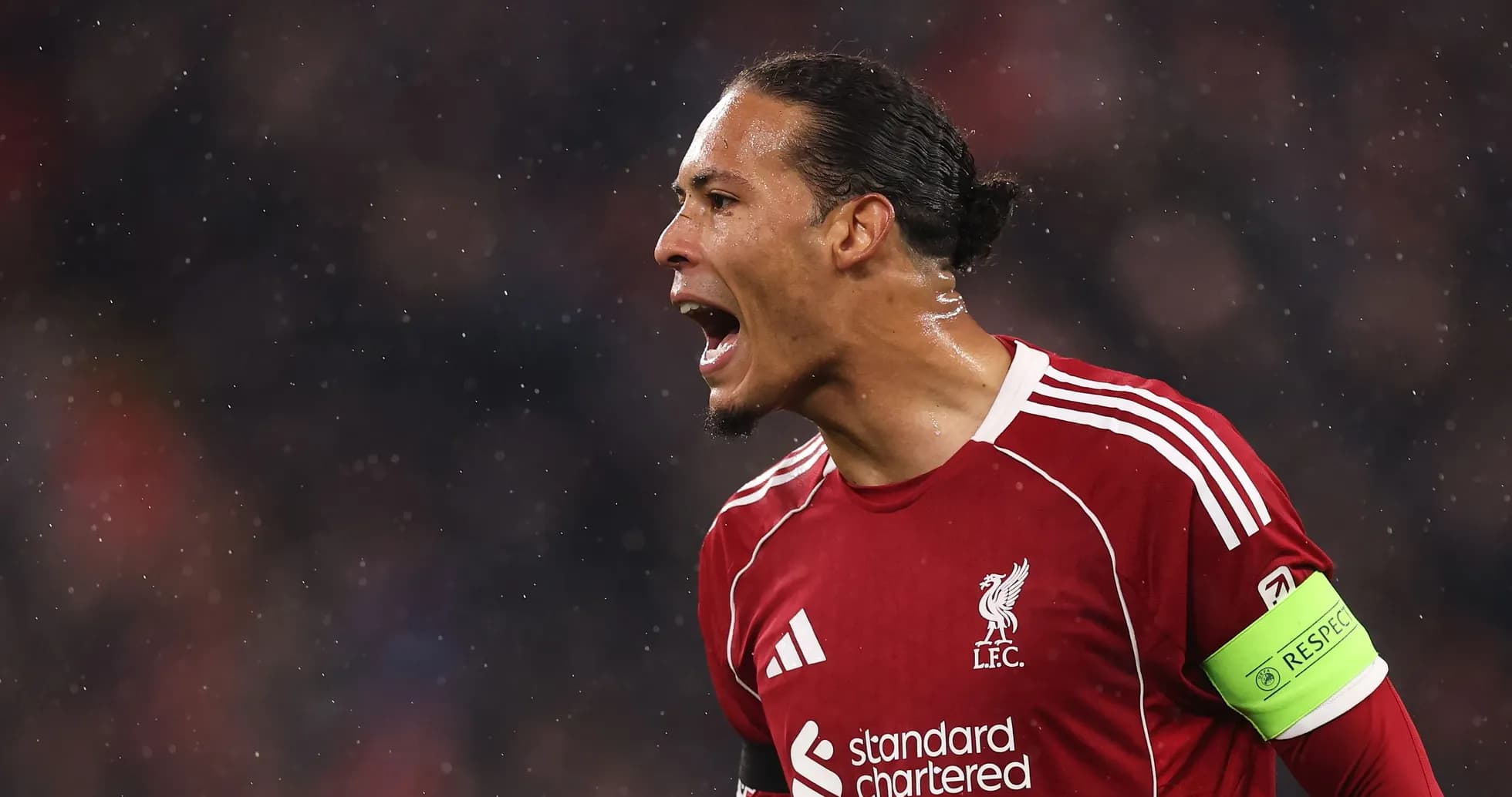 Player celebrating in Liverpool kit during match