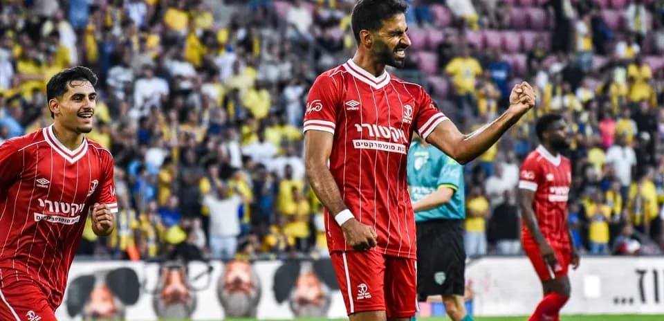 Players celebrating during Hapoel Beer Sheva match