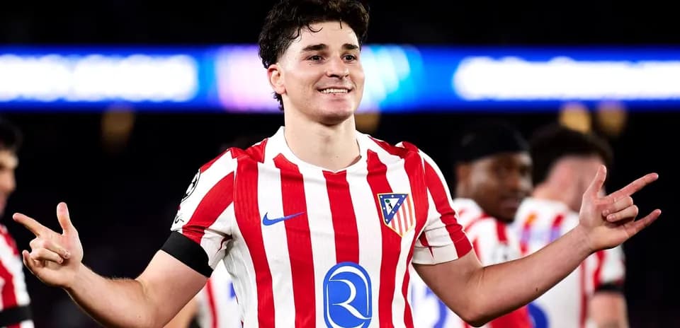 Player celebrating in Atletico Madrid jersey