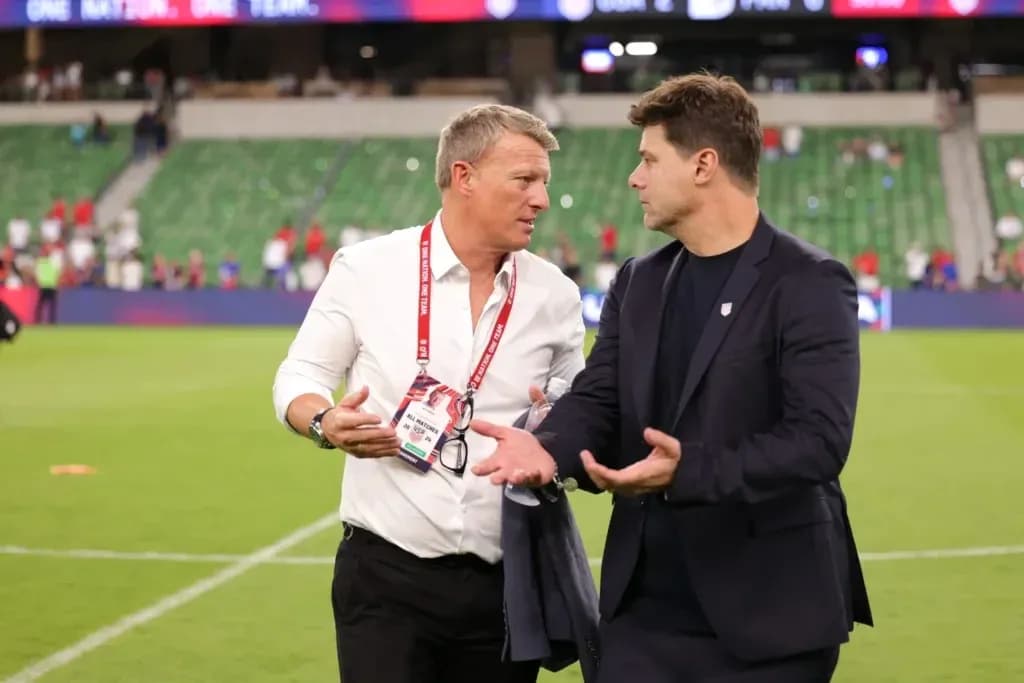 Two coaches discussing on the field after match